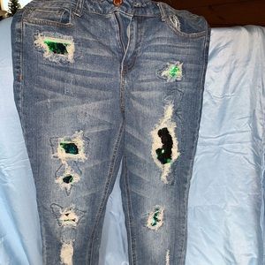 Skinny, ripped, mid-rise jeans size 9